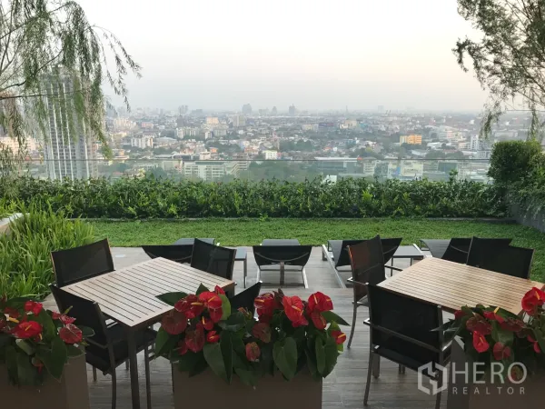 Condominium for rent in Watthana, Bangkok - Sky garden terrace with outdoor seating and sweeping city views.