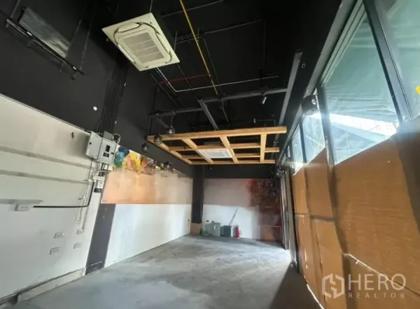 Retail Space for rent - Retail space with exposed black ceiling, cassette air-conditioning, track lights and full-height windows.
