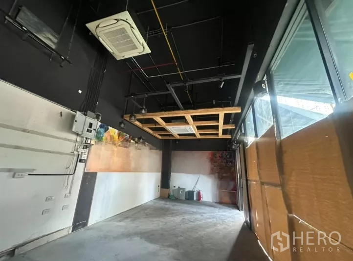 Retail Space for rent - Retail space with exposed black ceiling, cassette air-conditioning, track lights and full-height windows.
