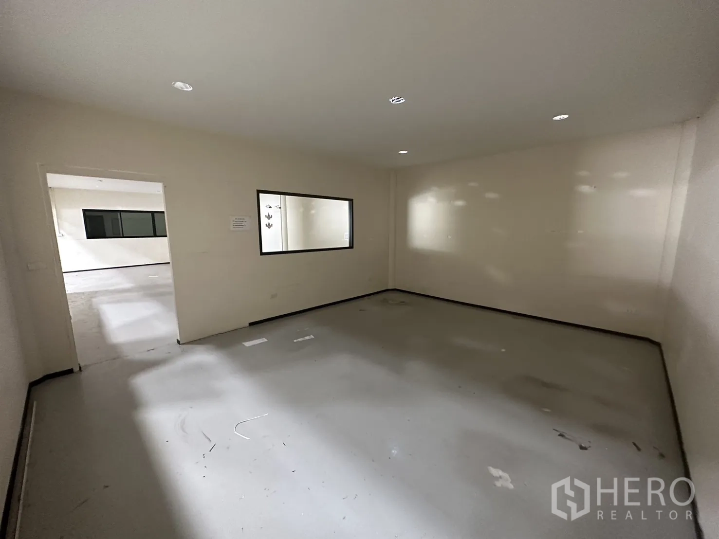 Warehouse for rent in Suan Luang, Bangkok - Private office room with internal glass window and recessed ceiling lights.