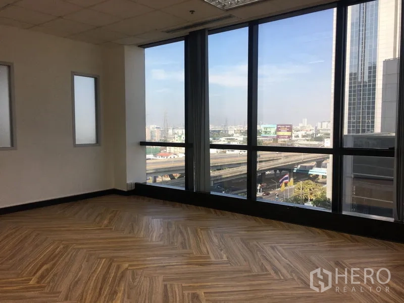 Office Space for rent in Chatuchak, Bangkok - Bright meeting room with herringbone wood floor and panoramic windows overlooking the expressway.