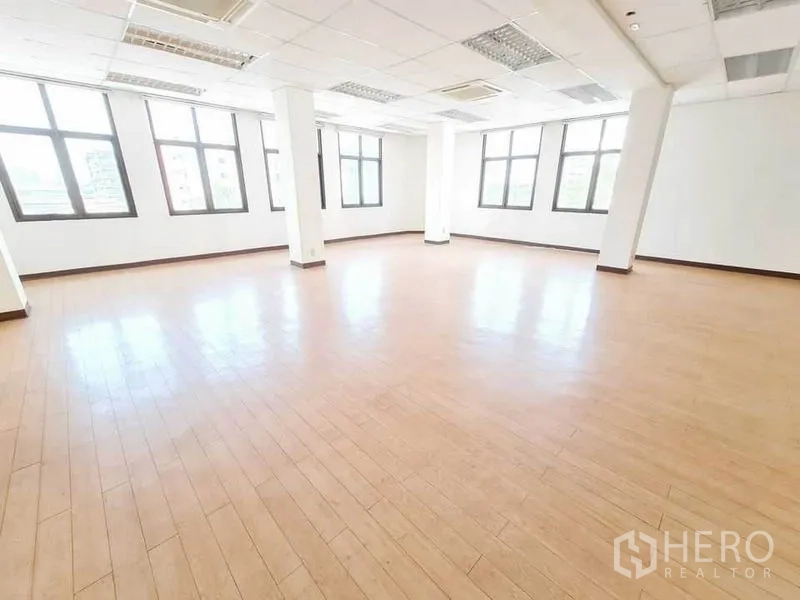 Office Space for rent in Bang Na, Bangkok - Corner office zone with multiple windows, ceiling air-conditioning and timber floors.