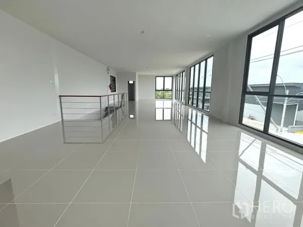 Factory for rent or sale in Bang Bo, Samut Prakan - Bright upper-floor office space with floor-to-ceiling windows overlooking the industrial area.