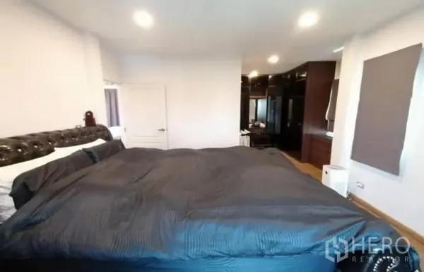 Detached House for sale in Bang Phli, Samut Prakan - Master bedroom view toward a walk-in wardrobe with recessed lighting in a Bang Phli detached house.