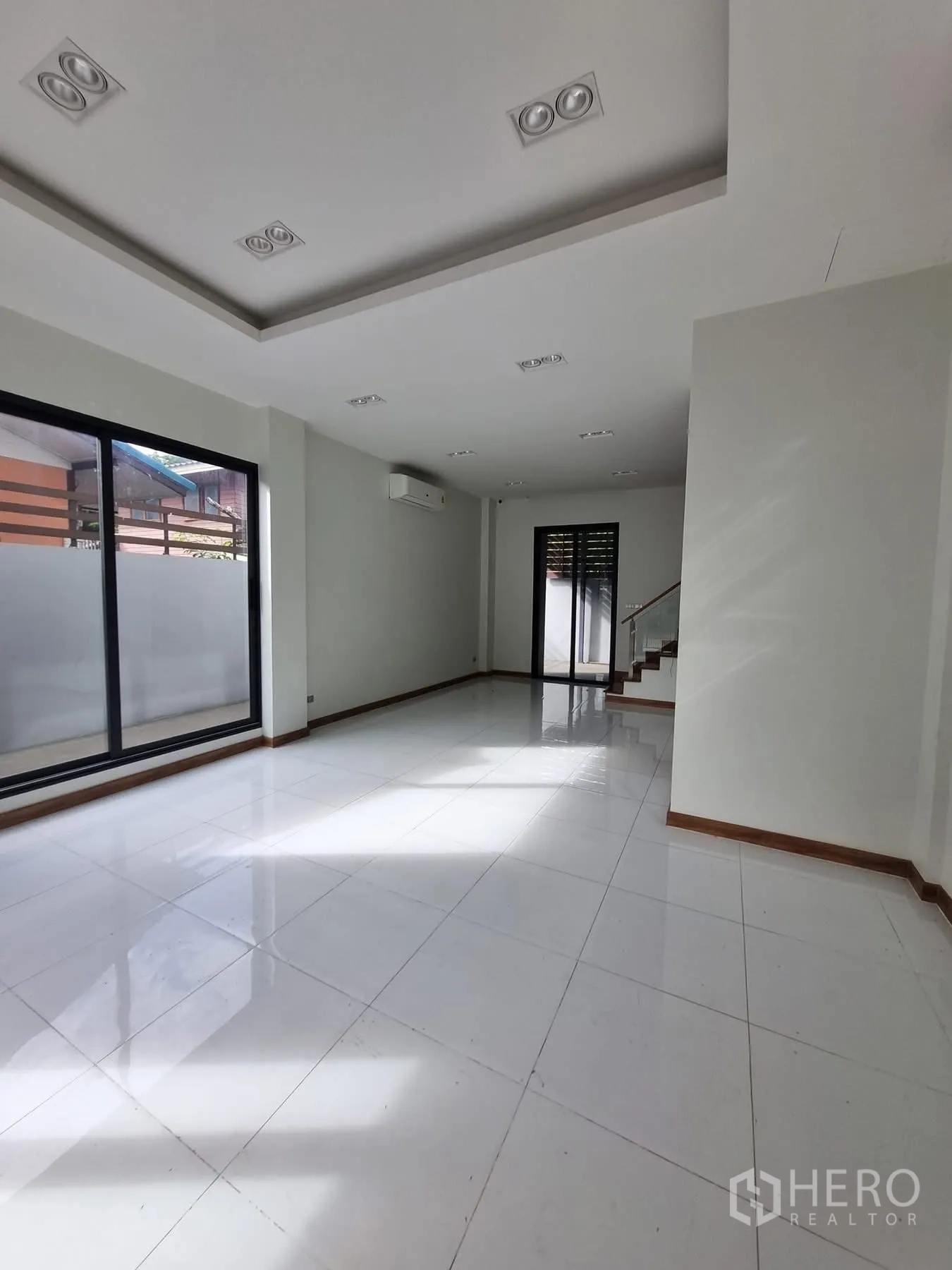 Home Office for rent in Khlong Toei, Bangkok - Bright open space with recessed ceiling lights and air conditioner.