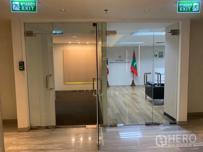 Office Space for rent in Bang Rak, Bangkok - Secure glass double-door office entrance with lobby and wood floors.