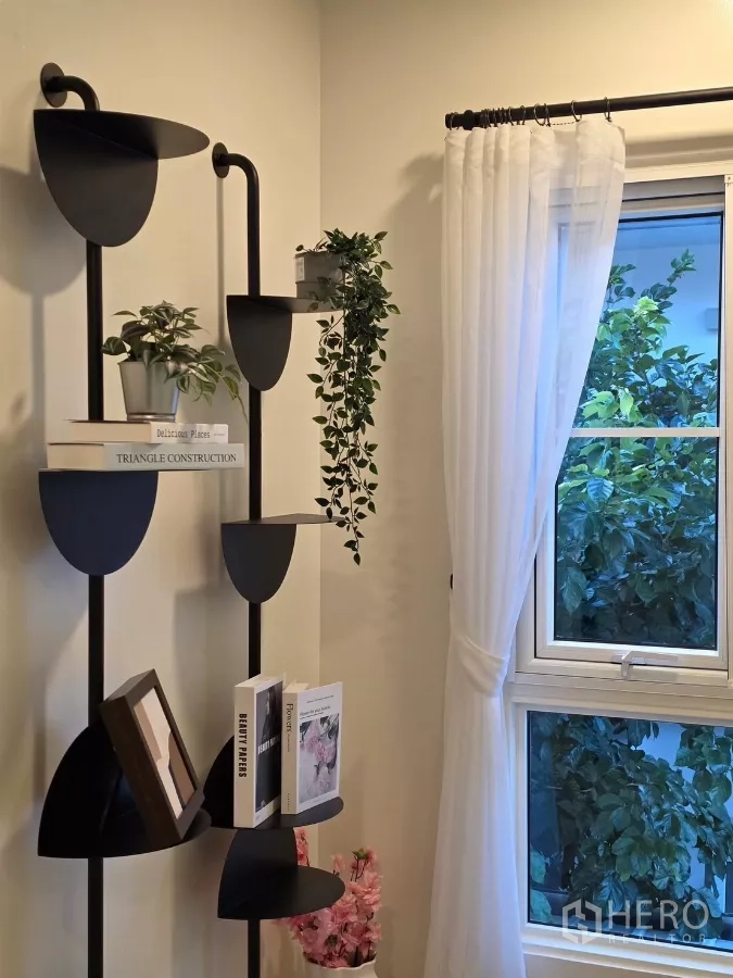 Detached House for rent in Bang Phli, Samut Prakan - Decorative wall shelves beside a window with sheer curtains and indoor plants.
