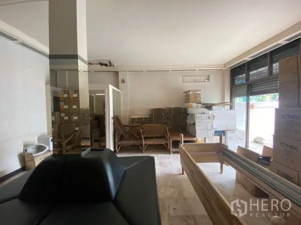 Retail Space for rent in Watthana, Bangkok - Ground-floor retail area with wide front windows, open layout and storage boxes, ready for fit-out.