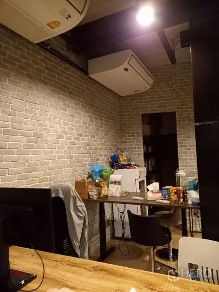 Office Space for rent in Chatuchak, Bangkok - Compact kitchenette and storage area with fridge beneath exposed ducted air-con.