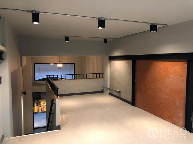 Retail Space for rent in Watthana, Bangkok - Mezzanine level overlooking the storefront, tiled floor and exposed ceiling lights.