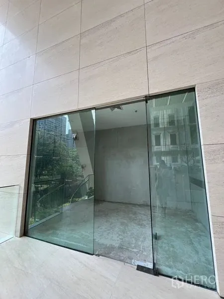 Retail Space for rent in Pathum Wan, Bangkok - Bright shopfront overlooking outdoor greenery and staircase, ready for tenant fit-out.