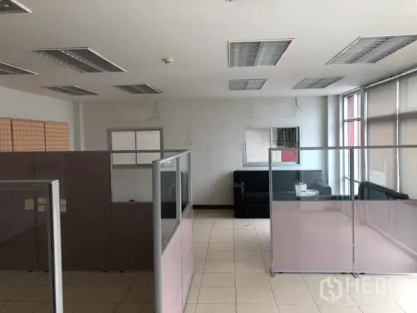 Factory for rent in Bang Sao Thong, Samut Prakan - Partitioned office area with workstations, tiled flooring and large windows.