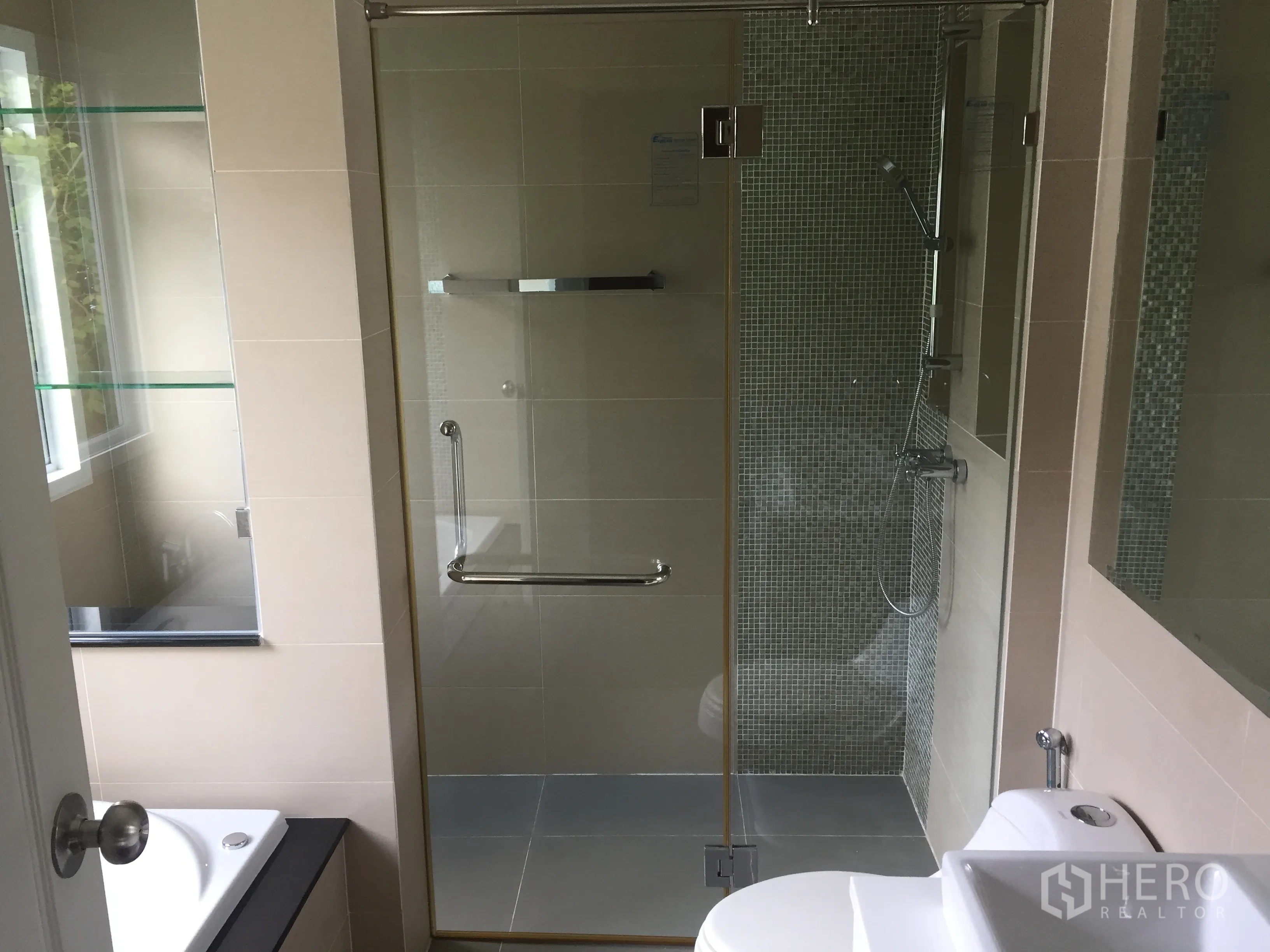 Detached House for sale in Saphan Sung, Bangkok - Contemporary bathroom with glass-enclosed shower, bathtub, and toilet.