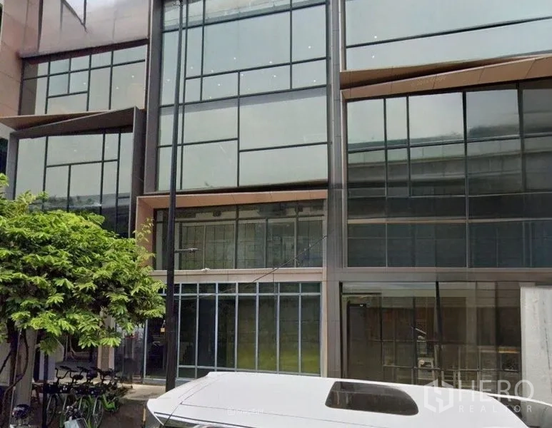 Retail Space for rent - Modern commercial building facade with full-height glass windows and street-level frontage.