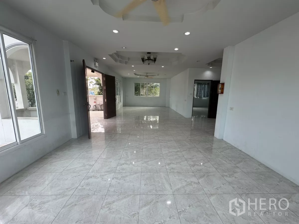 Home Office for rent - Reverse angle of the bright open-plan living and work area with downlights.