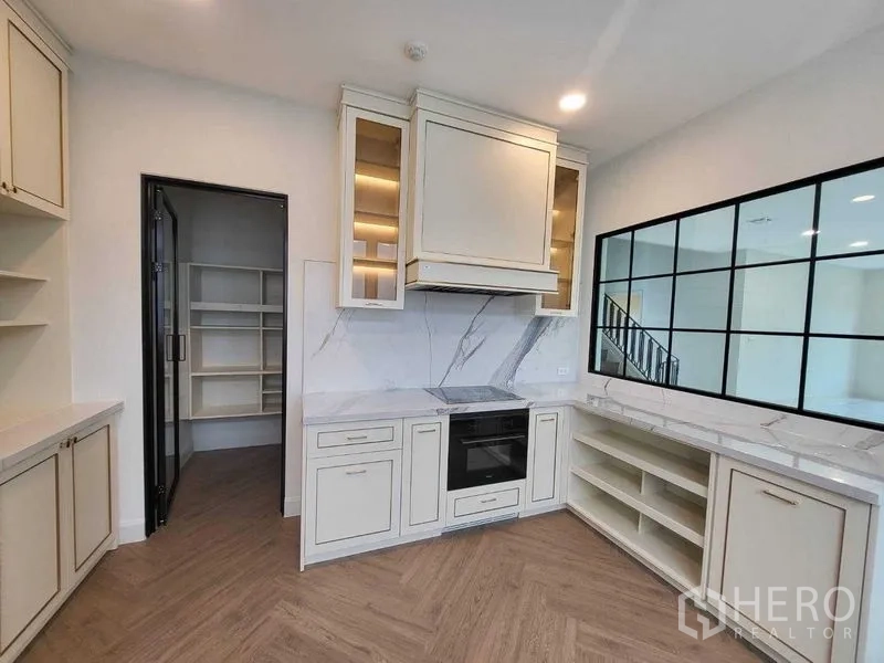 Detached House for rent in Saphan Sung, Bangkok - Contemporary two-storey detached house exterior with gated driveway and covered carport.
