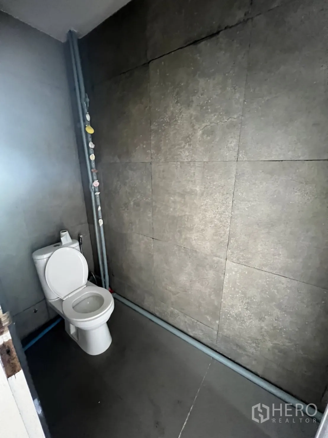 Shophouse for rent or sale in Watthana, Bangkok - Internal metal staircase connecting multiple shophouse floors.