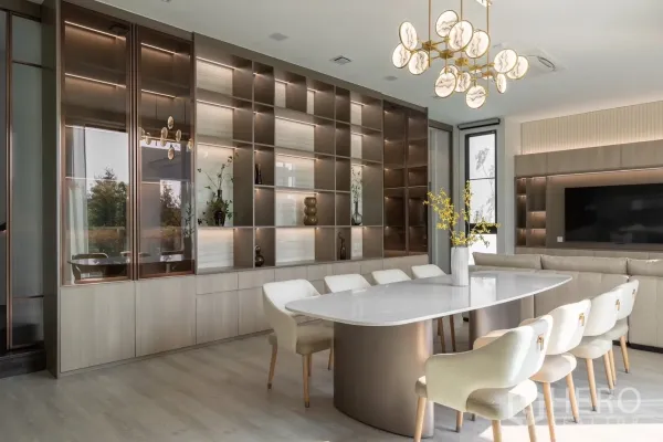 Detached House for rent in Saphan Sung, Bangkok - Elegant dining room with marble-style chandelier and illuminated display cabinetry.