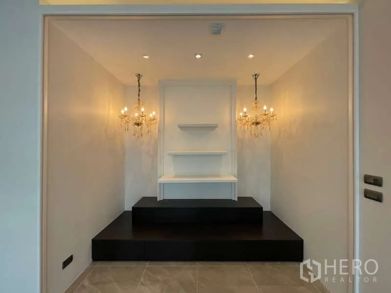 Detached House for rent or sale in Lat Krabang, Bangkok - Prayer or multipurpose alcove with raised platform, shelves and chandeliers.
