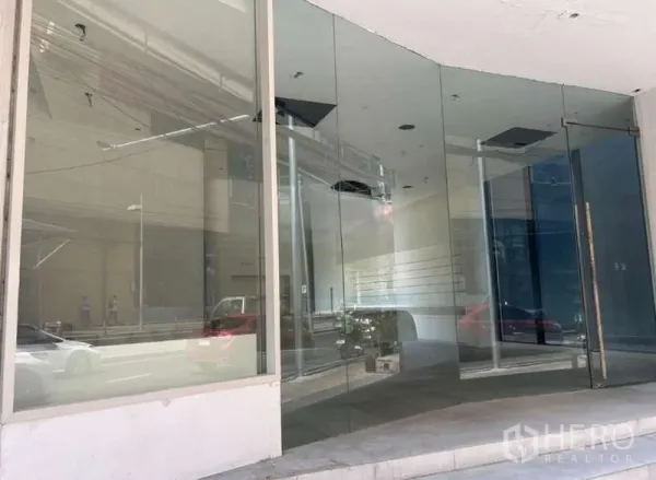 Standalone for rent in Khlong Toei, Bangkok - Street-facing glass storefront of a modern standalone commercial building near BTS Ekkamai.