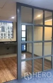 Office Space for rent in Bang Rak, Bangkok - Glass grid partition separating carpeted workspace from the pantry.