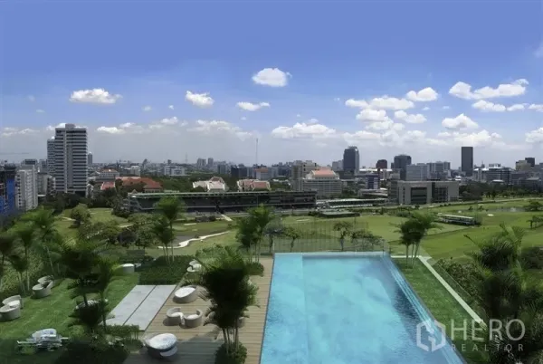 Condominium for rent in Pathum Wan, Bangkok - Rooftop infinity pool overlooking the Royal Bangkok Sports Club and cityscape.