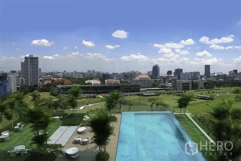 Condominium for rent in Pathum Wan, Bangkok - Rooftop infinity pool overlooking the Royal Bangkok Sports Club and cityscape.