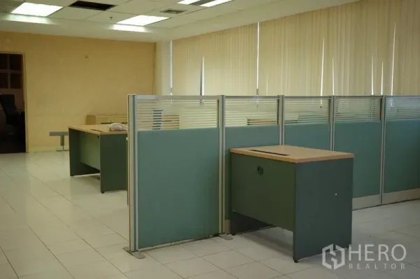 Office Space for rent in Bang Na, Bangkok - Open office area with workstations and glass-partition cubicles under grid lighting.
