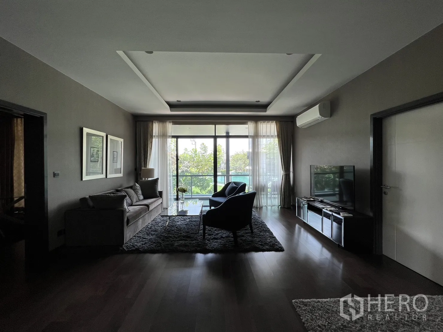 Detached House for rent or sale in Bang Kapi, Bangkok - Upper living room opening to a balcony with green garden views.