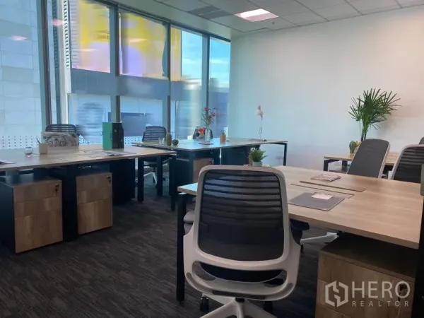 Office Space for rent in Sathon, Bangkok - Bright open-plan office with large desks, ergonomic chairs and floor-to-ceiling windows.