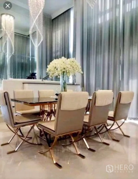 Detached House for sale in Saphan Sung, Bangkok - Elegant six-seat dining set beneath sculptural crystal pendants and tall drapes.
