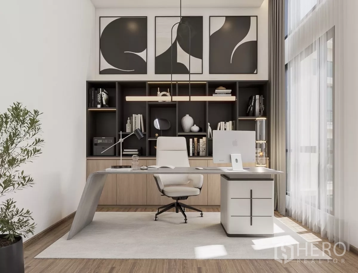 Townhouse for rent in Chatuchak, Bangkok - Home office with built‑in shelving, large desk and natural light.