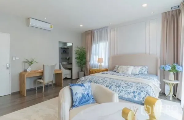 Detached House for rent in Bang Phli, Samut Prakan - Bright master bedroom with king bed, work desk and large windows with sheer curtains.