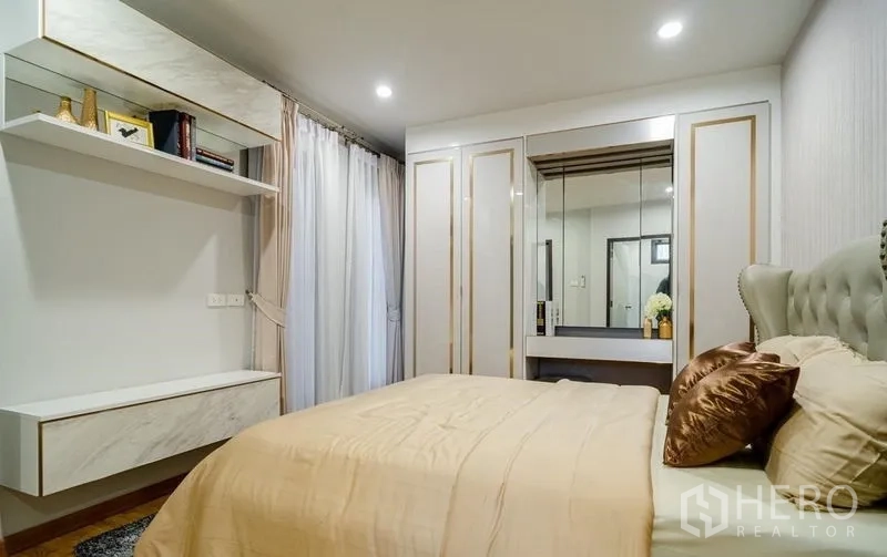Detached House for sale in Lam Luk Ka, Pathum Thani - Second bedroom angle showing built-in wardrobe and mirrored vanity.