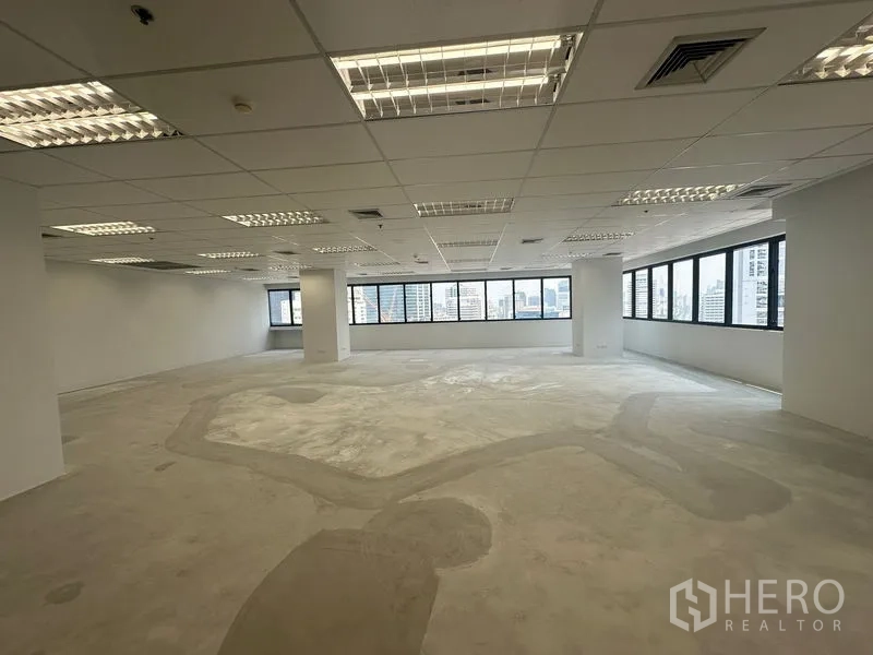 Office Space for rent in Bang Rak, Bangkok - Open-plan office with wraparound windows and skyline views across the Silom business district.