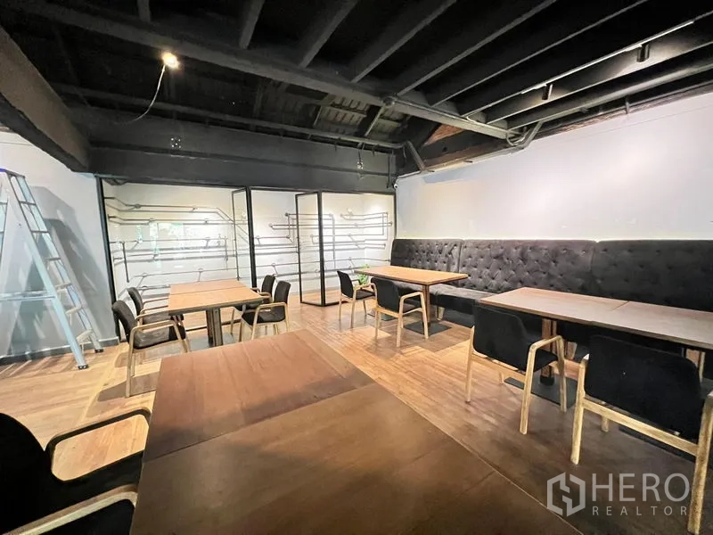 Retail Space for rent in Bangkok - Spacious dining area with tufted banquette, timber floor and exposed ceiling.