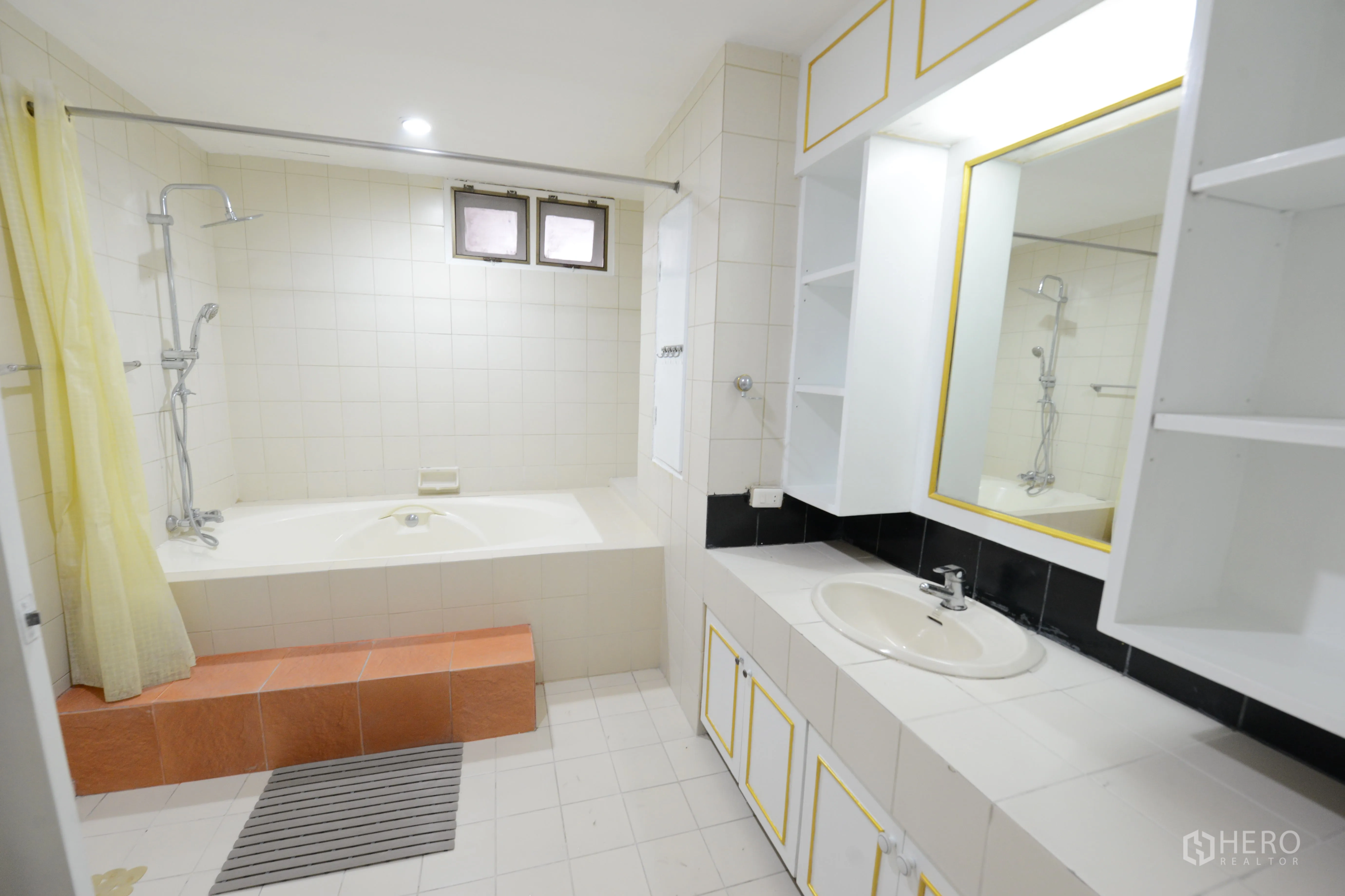 Condominium for rent or sale in Watthana, Bangkok - Bathroom with bathtub and shower, large mirror and storage vanity