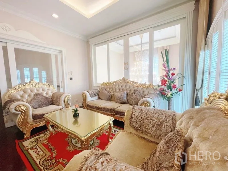 Detached House for rent in Bang Phli, Samut Prakan - Formal living room with plush gold sofas and a glass coffee table