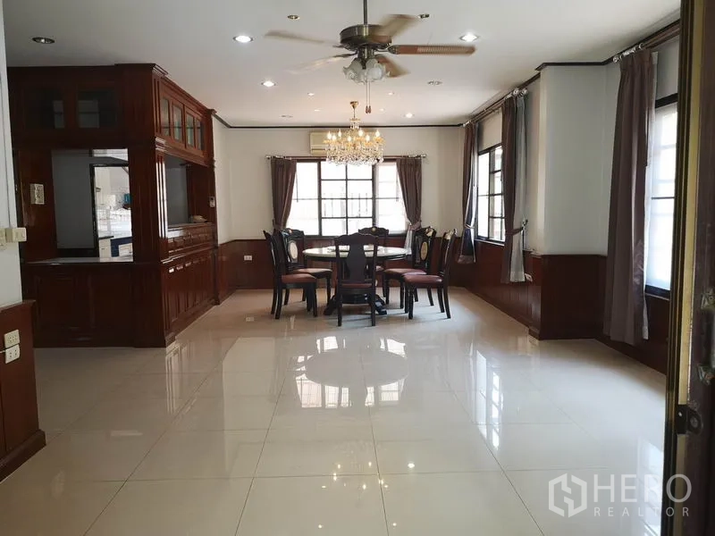 Detached House for sale - Dining room with chandelier, ceiling fan and surrounding windows.
