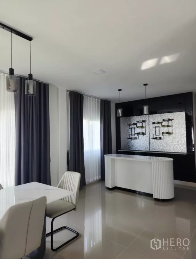 Detached House for rent in Bang Phli, Samut Prakan - Dining space with pendant lights, bar/display cabinet and full-length curtains