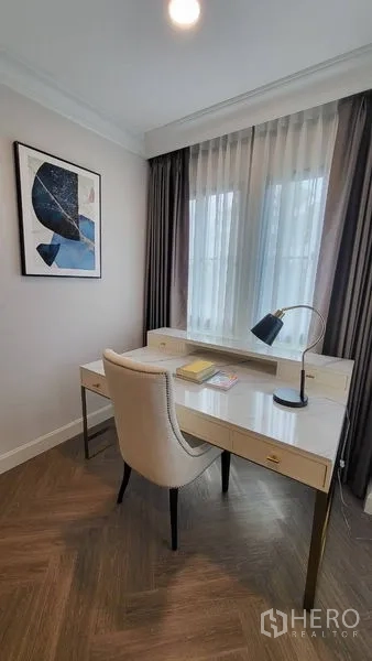 Detached House for rent or sale in Saphan Sung, Bangkok - Bright study corner with white desk, upholstered chair and sheer curtains.