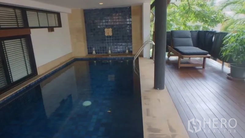 Detached House for rent in Watthana, Bangkok - Private shaded plunge pool with deep blue tiles and a sun lounger on the deck.