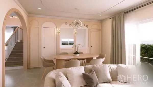 บ้าน ให้เช่าในBang Phli, Samut Prakan - พื้นที่นั่งเล่น–รับประทานอาหารแบบโอเพ่นแปลน ผนังโค้ง โต๊ะรูปวงรี และโคมไฟสไตล์โมเดิร์น