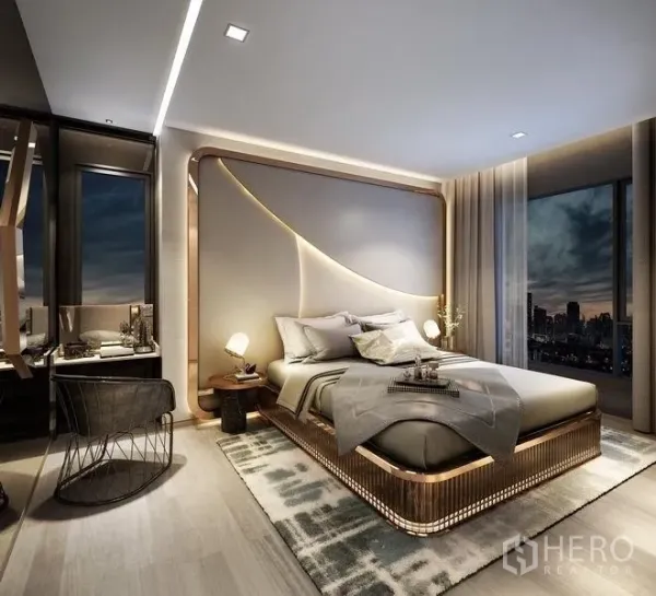 公寓 出售在Ratchathewi, Bangkok - 现代主卧，特色床头墙与床头灯，可观城市天际线。