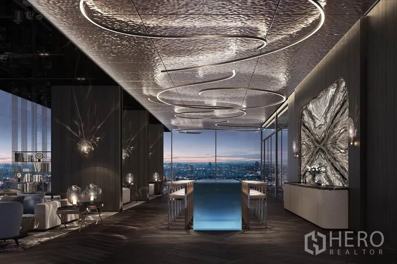 Condominium for sale in Bang Kho Laem, Bangkok - Sophisticated sky lounge with sculptural lighting and floor-to-ceiling windows framing night views.