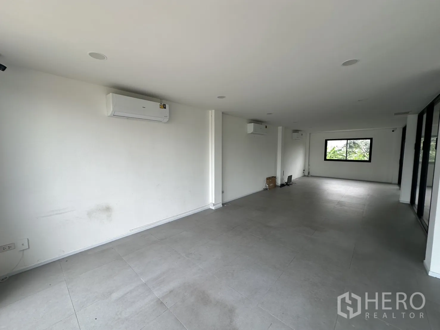 Home Office for rent or sale in Bang Na, Bangkok - Spacious open-plan room with AC units and windows at both ends.