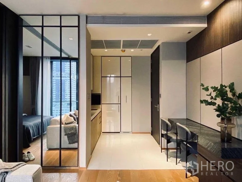 Condominium for rent or sale - Compact kitchen with built-in fridge, sleek cabinets and dining nook.