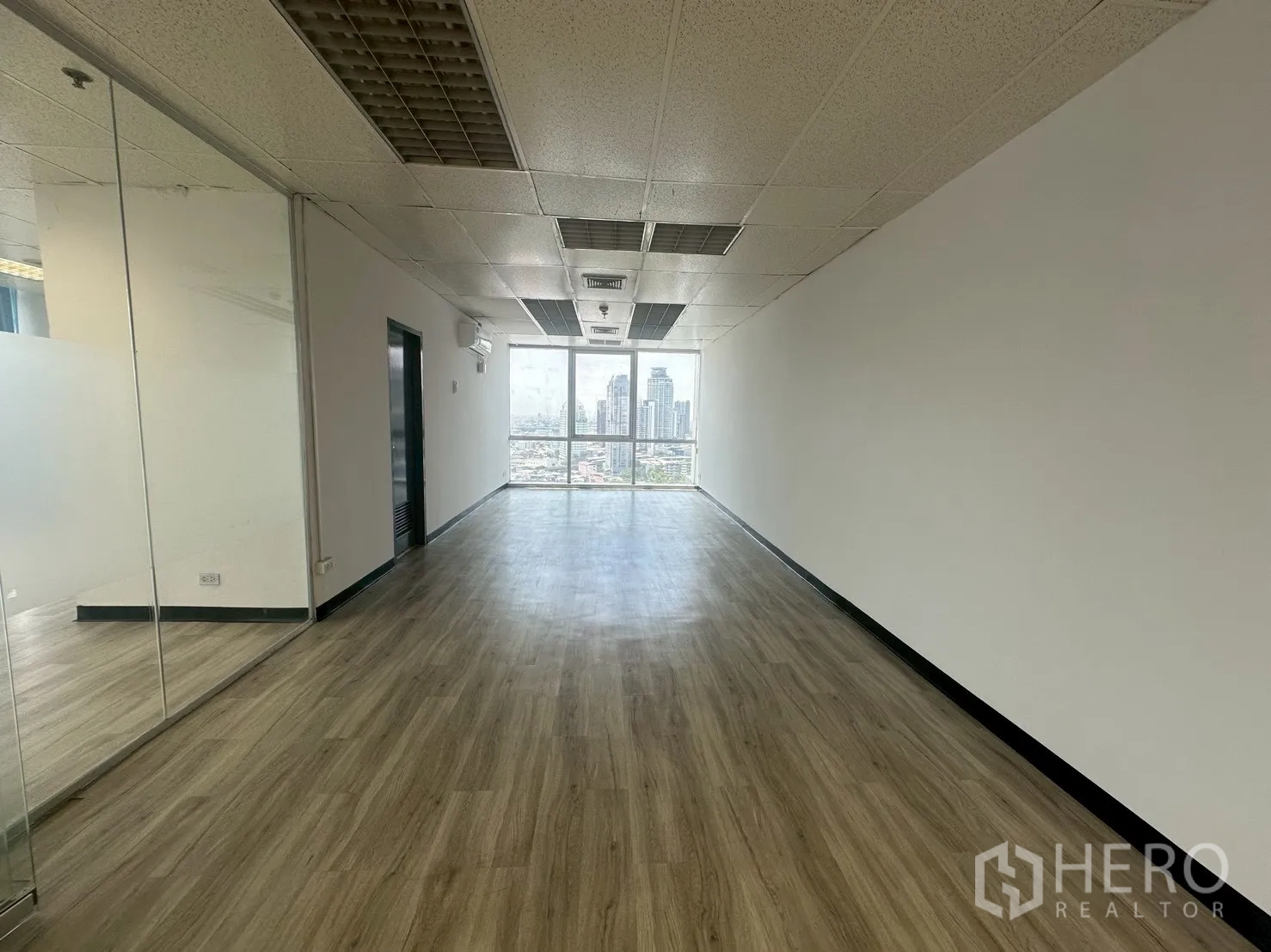 Office Space for rent - Long private room or team area with large end window overlooking the city.