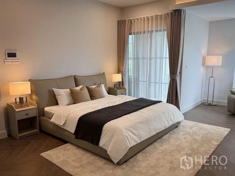 Detached House for rent or sale - Master suite with a king bed, bedside lamps, and an adjoining sitting area.