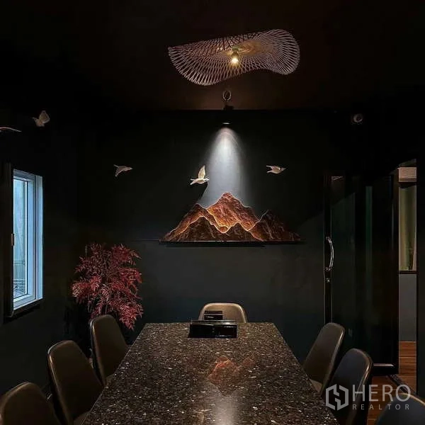 Detached House for rent in Watthana, Bangkok - Private room with long granite table, accent spotlight and minimalist wall sculpture.